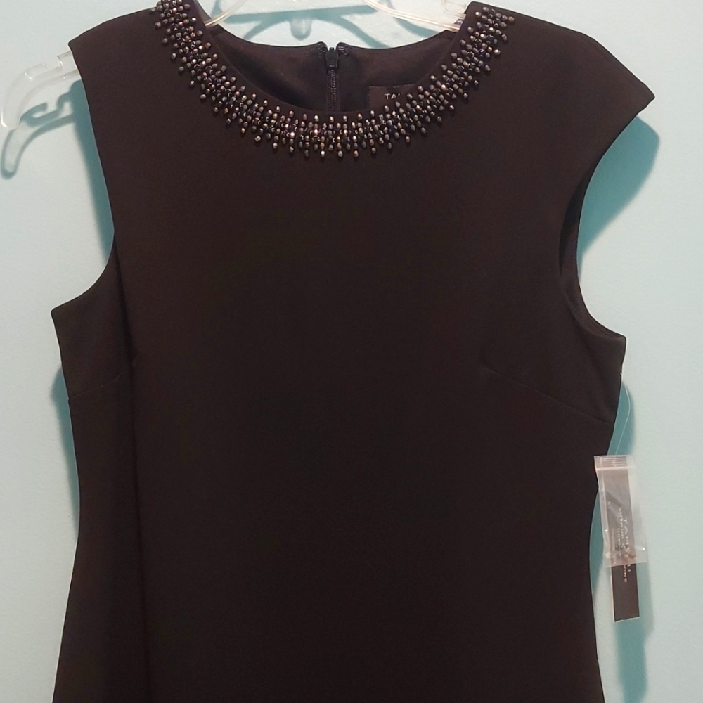 Simple black cocktail dress with beaded neck embellishments